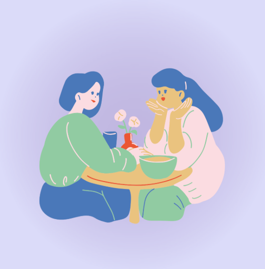 Zwei Leute sitzen an einem Tisch und himmeln sich an.